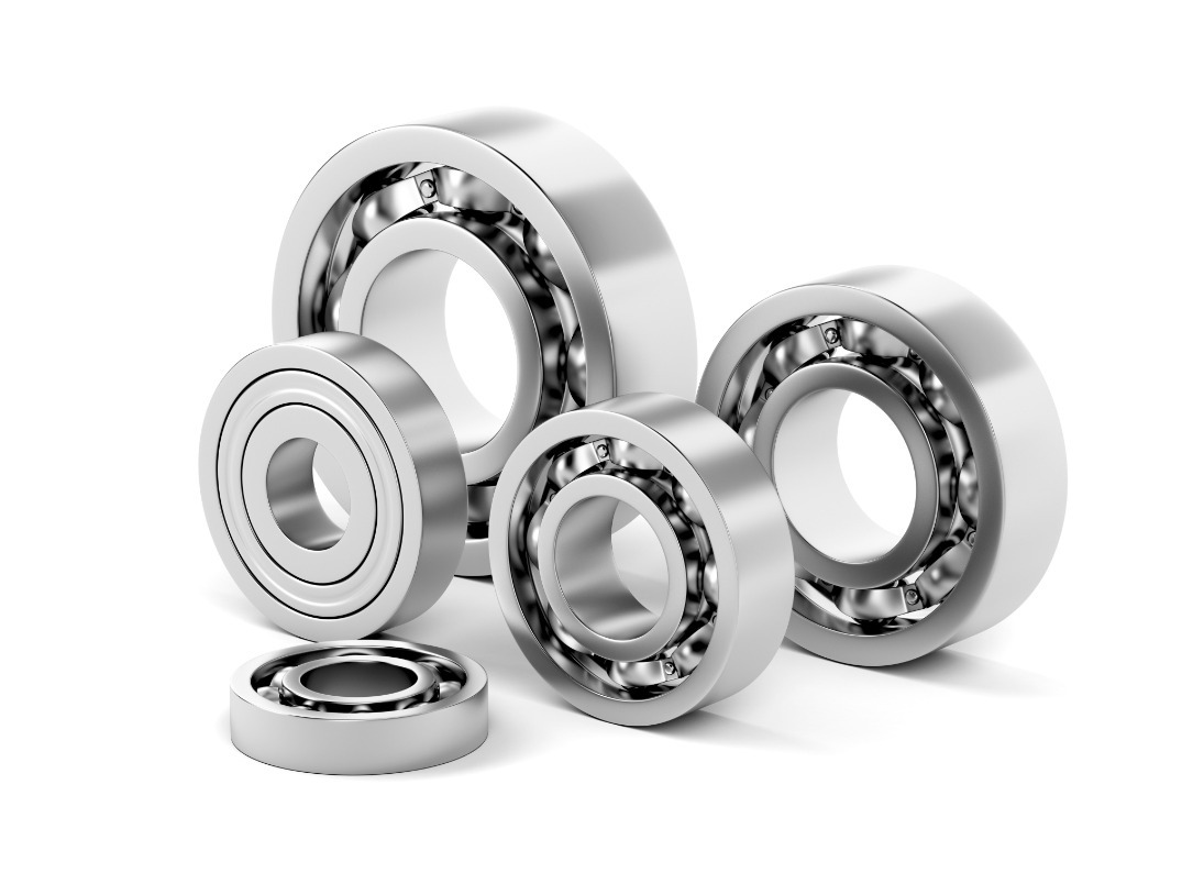 Assorted ball bearings flipped to show raceways and surfaces