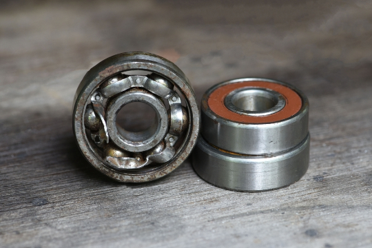 Broken ball bearings showing signs of wear and mechanical failure